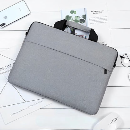 Housse ordinateur gris posé sur le sol